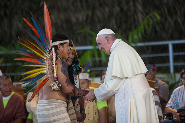 Pope Francis greets indigenous representatives in Puerto Maldonado, Peru, Friday, Jan. 19, 2018